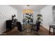 Contemporary dining room with modern lighting fixture and glass table at 8317 E Orange Blossom Ln, Scottsdale, AZ 85250