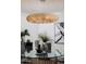Close up of the modern lighting fixture in a contemporary dining room at 8317 E Orange Blossom Ln, Scottsdale, AZ 85250