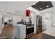 Kitchen with white cabinets, an island, and stainless steel appliances at 8317 E Orange Blossom Ln, Scottsdale, AZ 85250