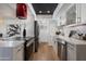 Modern kitchen with white cabinets, stainless steel appliances, and an island at 8317 E Orange Blossom Ln, Scottsdale, AZ 85250