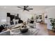 Stylish living room with wood floors, modern decor, and natural light from the window at 8317 E Orange Blossom Ln, Scottsdale, AZ 85250