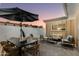 Outdoor patio with dining and seating area provides space for relaxing and entertaining at 8317 E Orange Blossom Ln, Scottsdale, AZ 85250