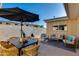 An outdoor patio with dining and seating areas provides space for relaxing and entertaining at 8317 E Orange Blossom Ln, Scottsdale, AZ 85250
