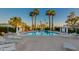 Community pool surrounded by lush landscaping and lounge chairs at 8317 E Orange Blossom Ln, Scottsdale, AZ 85250