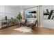 Cozy sitting area featuring hardwood floors, natural light, and stylish decor at 8317 E Orange Blossom Ln, Scottsdale, AZ 85250