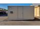 Tan storage unit in parking area with door and meter at 8317 E Orange Blossom Ln, Scottsdale, AZ 85250