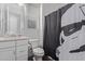 Bathroom with single sink vanity, toilet, and a shower featuring a Star Wars curtain at 939 E Paseo Way, Phoenix, AZ 85042