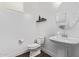Powder room featuring modern sink, toilet and decorative items at 939 E Paseo Way, Phoenix, AZ 85042