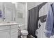 Bathroom with single sink vanity, a toilet, and shower with Star Wars curtain at 939 E Paseo Way, Phoenix, AZ 85042