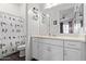 Bright bathroom featuring a shower with charming bird-themed curtains and a spacious vanity area at 939 E Paseo Way, Phoenix, AZ 85042