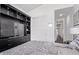 Bedroom featuring built in shelving and TV with sliding closet doors at 939 E Paseo Way, Phoenix, AZ 85042