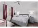 Cozy bedroom featuring modern decor, ceiling fan and hardwood floors at 939 E Paseo Way, Phoenix, AZ 85042