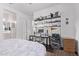 Cozy bedroom with a dedicated desk area and convenient shelving for optimal organization at 939 E Paseo Way, Phoenix, AZ 85042