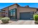 A modern single-Gathering home boasting a two-car garage and unique desert landscaping at 939 E Paseo Way, Phoenix, AZ 85042