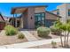 Inviting home with a walkway leading to a covered entrance, complemented by low-maintenance landscaping at 939 E Paseo Way, Phoenix, AZ 85042