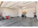 Spacious garage with a clean, epoxy-coated floor, ready for vehicles or storage at 939 E Paseo Way, Phoenix, AZ 85042