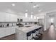 Modern kitchen features white cabinets, granite countertops, and stainless steel appliances at 939 E Paseo Way, Phoenix, AZ 85042