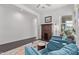 Cozy living room with comfortable blue armchairs, and a stylish area rug at 939 E Paseo Way, Phoenix, AZ 85042