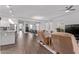 This open floor plan boasts a dining area, kitchen, and living room with stylish decor at 939 E Paseo Way, Phoenix, AZ 85042