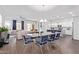 Open floor plan boasts living room, dining area and kitchen with island and seating at 939 E Paseo Way, Phoenix, AZ 85042