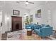 Bright living room featuring two blue armchairs, stylish decor, and natural light at 939 E Paseo Way, Phoenix, AZ 85042
