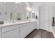 Main bathroom with double sink vanity and a glass enclosed shower and a soaking tub at 939 E Paseo Way, Phoenix, AZ 85042