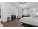 Bright main bedroom with hardwood floors, neutral decor and an accent chair at 939 E Paseo Way, Phoenix, AZ 85042