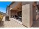 Comfortable covered patio, great for outdoor relaxation and entertaining with stone flooring at 939 E Paseo Way, Phoenix, AZ 85042
