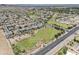 An aerial view of the community featuring homes, green spaces, and mountain views at 9722 S 45Th Ave, Laveen, AZ 85339