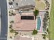 Overhead shot of a home with solar panels and a private pool amidst desert landscaping, providing an aerial perspective at 9722 S 45Th Ave, Laveen, AZ 85339