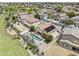 A lush backyard, captured from above, highlights a sparkling pool, desert landscaping, and solar panels on the roof at 9722 S 45Th Ave, Laveen, AZ 85339