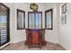 View of the dark wood bar with custom shutters and stained glass hanging light at 9722 S 45Th Ave, Laveen, AZ 85339