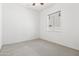 A clean and simple bedroom with white walls and neutral carpet and a window at 9722 S 45Th Ave, Laveen, AZ 85339
