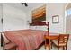Cozy bedroom features wood furniture, accent art, and a window providing natural light at 9722 S 45Th Ave, Laveen, AZ 85339