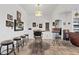 Dining area with adjacent bar and decorative lighting fixture at 9722 S 45Th Ave, Laveen, AZ 85339