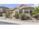 Charming single-Gathering home featuring beautiful desert landscaping, a fountain, and a two-car garage at 9722 S 45Th Ave, Laveen, AZ 85339