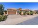 Charming single-story home featuring a desert landscape and a two-car garage at 9722 S 45Th Ave, Laveen, AZ 85339