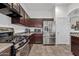 Well-equipped kitchen featuring stainless steel appliances and lots of counter space at 9722 S 45Th Ave, Laveen, AZ 85339