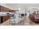 Spacious kitchen with barstool seating that opens up into an ample living space at 9722 S 45Th Ave, Laveen, AZ 85339