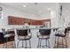 Kitchen featuring barstool seating with direct view and access to the living room at 9722 S 45Th Ave, Laveen, AZ 85339