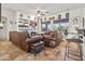 Comfortable living room with leather sofas, tile floors, a fireplace, and a bar at 9722 S 45Th Ave, Laveen, AZ 85339