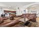 Spacious living room featuring leather furniture and tile flooring at 9722 S 45Th Ave, Laveen, AZ 85339