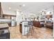 Connected kitchen and living space, featuring tile flooring and stainless steel appliances at 9722 S 45Th Ave, Laveen, AZ 85339