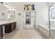 Main bathroom featuring double sinks and tub and shower at 9722 S 45Th Ave, Laveen, AZ 85339