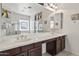 The main bathroom features double sinks and large vanity at 9722 S 45Th Ave, Laveen, AZ 85339