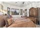 The Main bedroom features a ceiling fan and windows with plantation shutters at 9722 S 45Th Ave, Laveen, AZ 85339
