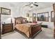 Comfortable bedroom features a ceiling fan and plantation shutters at 9722 S 45Th Ave, Laveen, AZ 85339