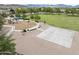 A community park featuring a playground, a basketball court, and mature trees at 9722 S 45Th Ave, Laveen, AZ 85339