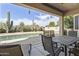 Enjoy relaxing outdoor living space under a covered patio next to the sparkling pool at 9722 S 45Th Ave, Laveen, AZ 85339