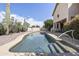 Beautiful pool features desert landscaping, a cool deck, and plenty of space for entertaining at 9722 S 45Th Ave, Laveen, AZ 85339